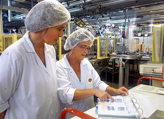Bel employees working together in facility