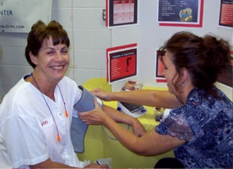 Bel employee getting blood pressure taken